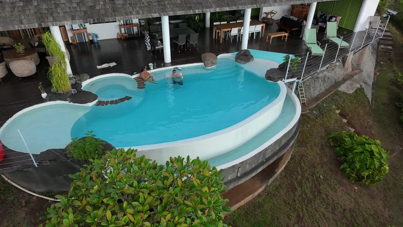 Bird's-eye drone view over the infinity pool