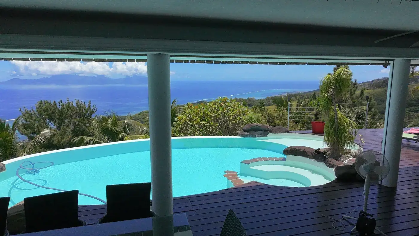 Drone shot of pool with lagoon and Moorea in background