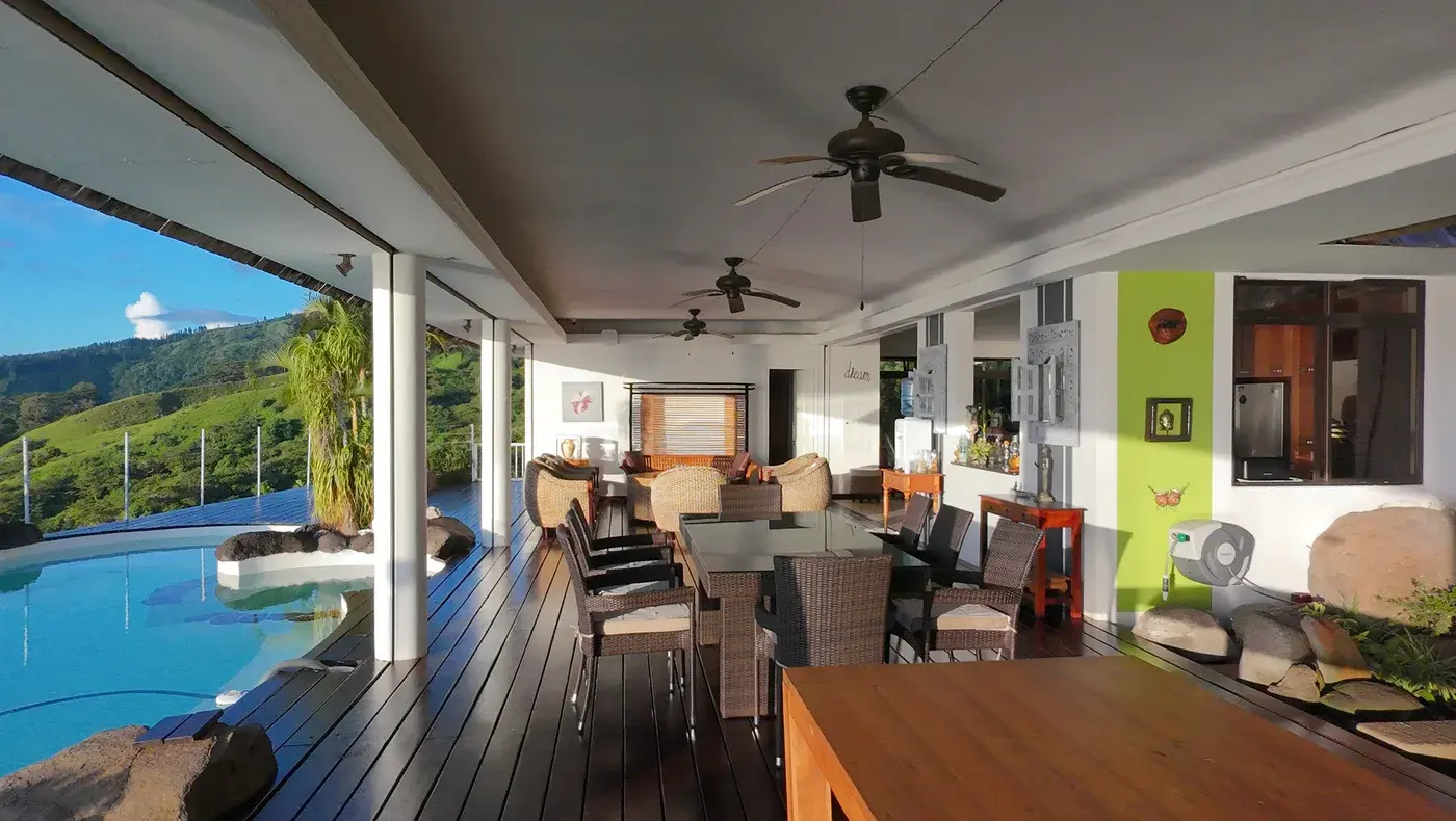 Spacious open-plan dining room with tropical garden view
